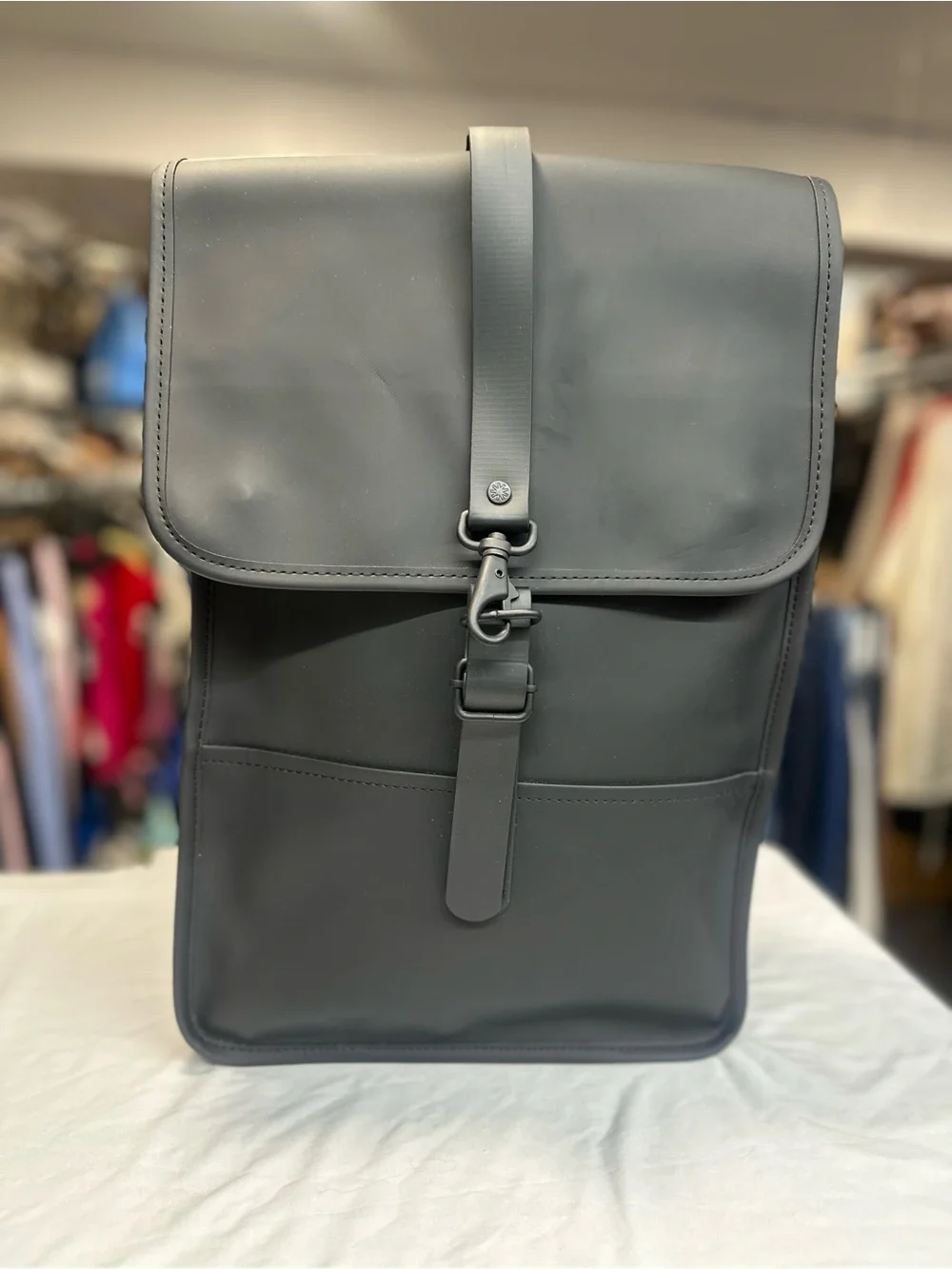Rains  Backpack is clean and ever-contemporary. Like new no tag